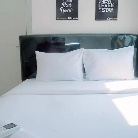 2Br Fully Furnished Minimalist Bassura City Apartment By Travelio
